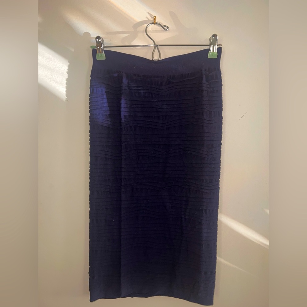 worn mid-leg blue skirt. In good condition. Super stretchy